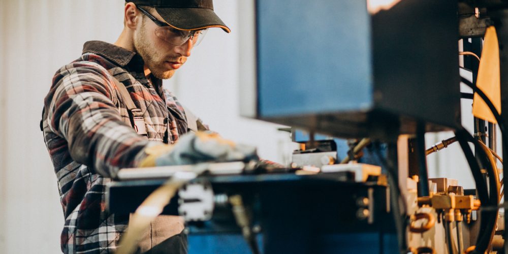 Man working on steel fatory and equipment for steel production