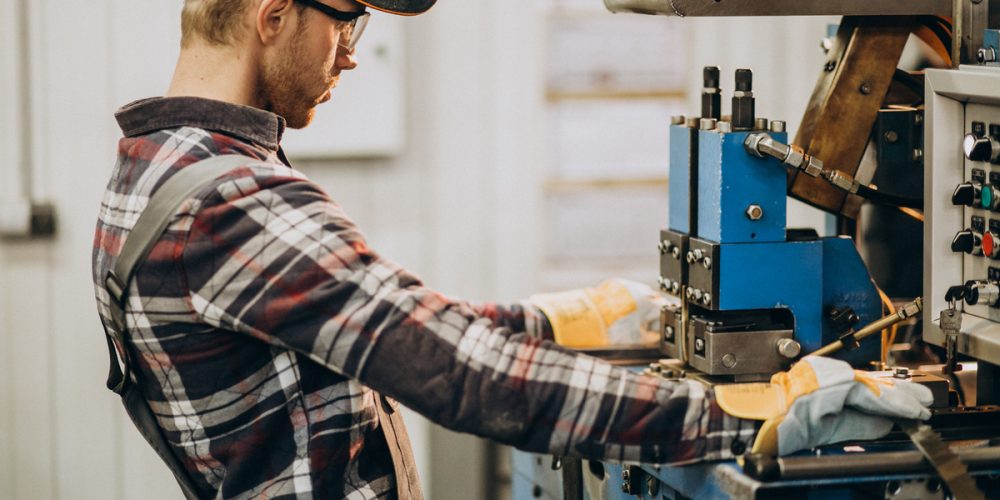 Man working on steel fatory and equipment for steel production